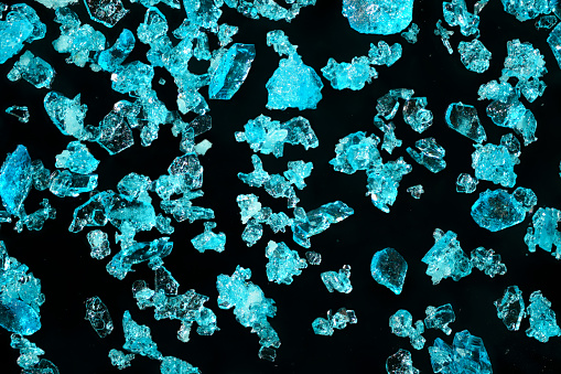 Blue copper sulphate crystals under 4x microscope magnification - image width = 9mm