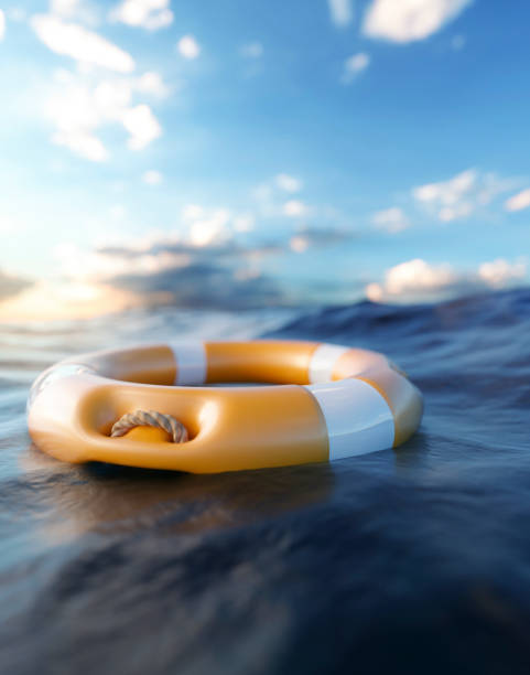 istock Orange rescue ring floating in the sea 3d render 1365579346