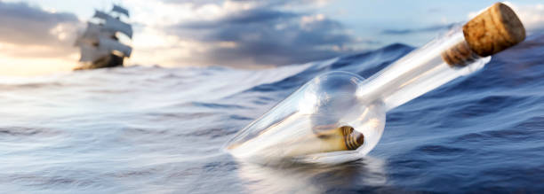 istock Message in a bottle in the sea 3d render 1365579482