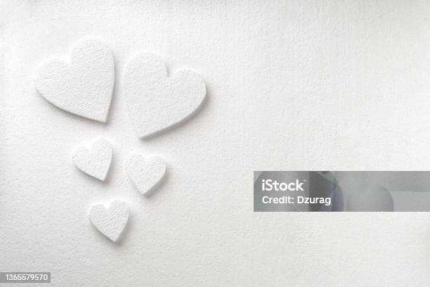 Background With White Styrfoam Hearts On The Sheet Of A White Styrfoam Stock Photo - Download Image Now