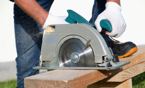 istock A male joiner works with a hand-held circular saw. A builder is sawing a board at the construction site of a new house. 1365580397
