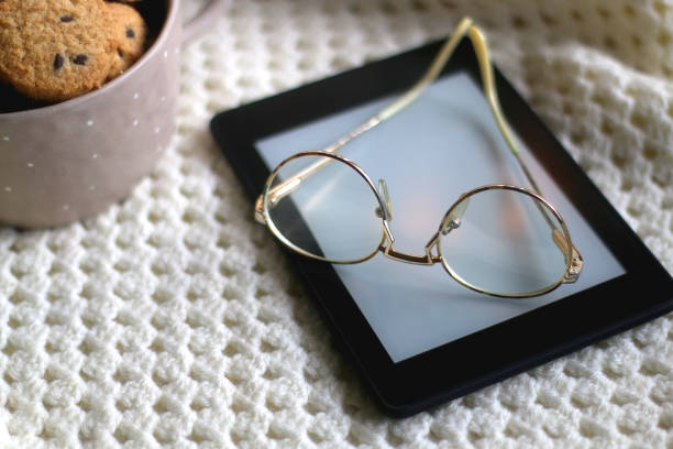 istock Tablet, Glasses, Cookies and Blanket 1365583392
