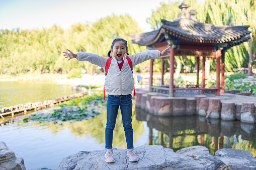 Little girl in classical chinese garden