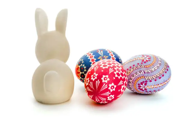 Easter bunny and Sorbian Easter eggs as decoration on white background