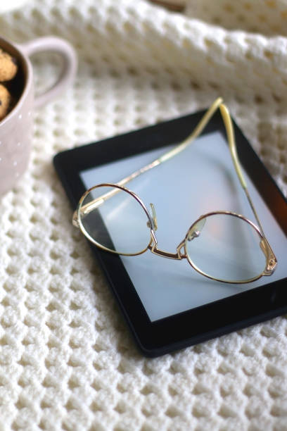 istock Tablet, Glasses, Cookies and Blanket 1365584777