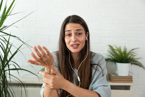 istock Young woman internet content creator talking live on online video call about her personal negative experience with cyber bullying. Female health care worker web conference tele meeting. 1365584945