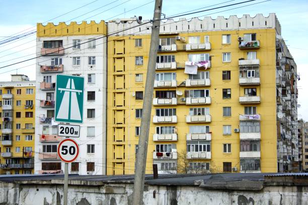 ugly yellow residential building. multistory building in yellow. soviet architecture. - perestroika imagens e fotografias de stock