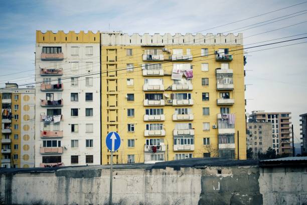 ugly yellow residential building. multistory building in yellow. soviet architecture. - perestroika imagens e fotografias de stock