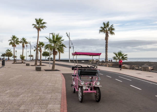 Family bike for rent on the beach in Lanzarote, Canary Islands, Spain stock photo