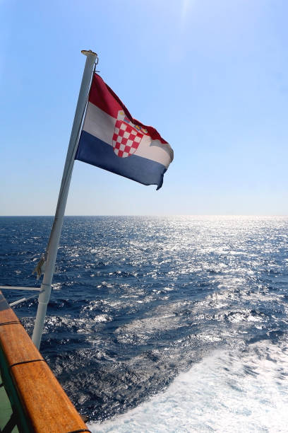istock Croatian Flag and Adriatic Sea 1365592351