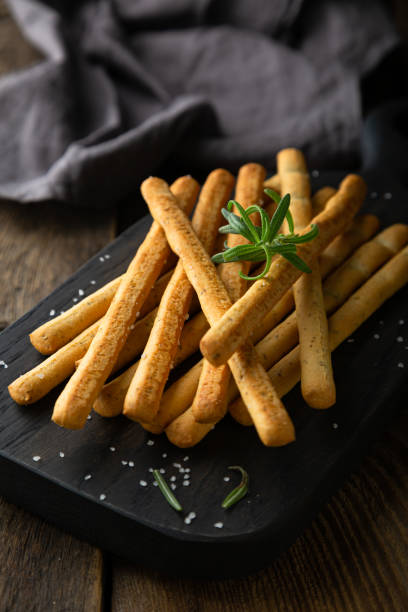 istock Crispy bread sticks with salt and rosemary 1365595625