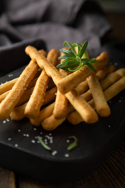 istock Crispy bread sticks with salt and rosemary 1365595659
