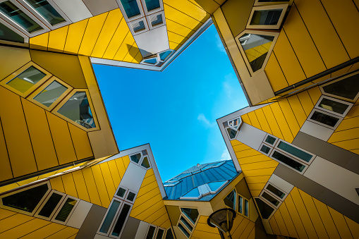 ROTTERDAM, NETHERLANDS - MAY 11, 2017: Cube houses - innovative cube-shaped houses designed by architect Piet Blom with idea to optimize space in Rotterdam, Netherlands now became a tourist attraction