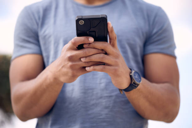 istock Shot of an unrecognisable man using a smartphone outside at college 1365601579