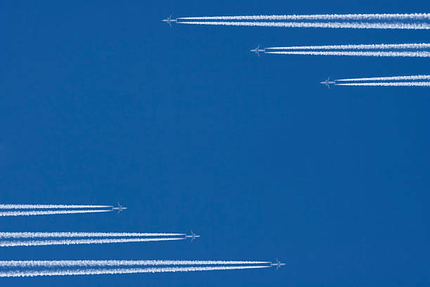 Airplanes in a Blue Sky with Vapor Trail, Air Traffic