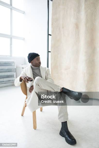 Elegant Young Man Wearing White Winter Coat Stock Photo - Download Image Now - Fashion, Men, Fashion Model