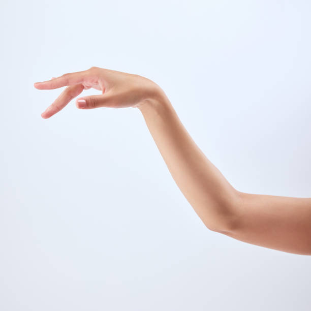 istock Studio shot of an unrecognizable woman’s beautiful hand against a grey background 1365603627