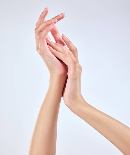 istock Studio shot of an unrecognizable woman’s beautiful hands against a grey background 1365603634