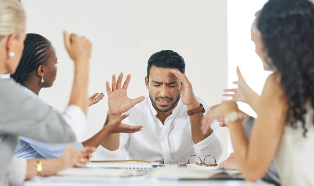 istock Shot of a young businessman experiencing a headache at work 1365603888