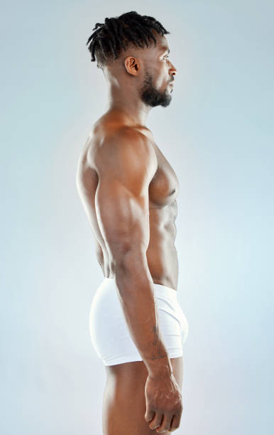 istock Studio shot of a muscular young man posing shirtless 1365604333