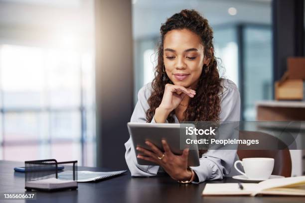 Shot Of A Young Businesswoman Using A Digital Tablet While At Work Stock Photo - Download Image Now