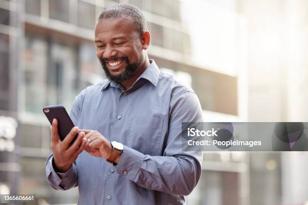 Shot Of A Businessman Using His Smartphone Outside In The City Stock Photo - Download Image Now