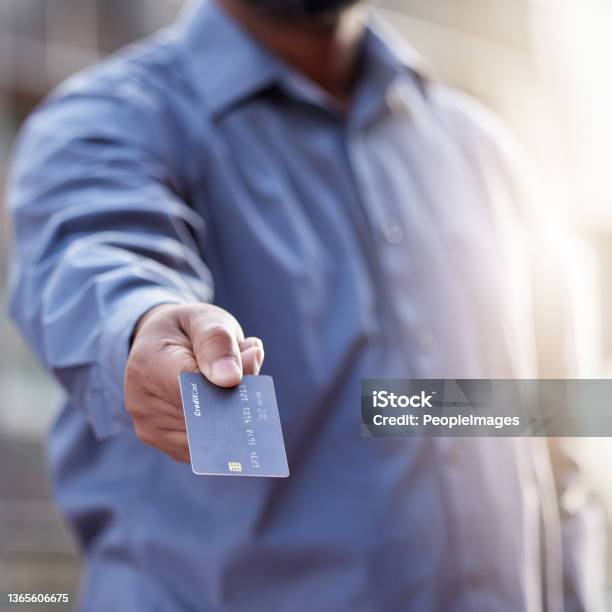 Shot Of A Unrecognizable Man Holding A Credit Card Outside Stock Photo - Download Image Now