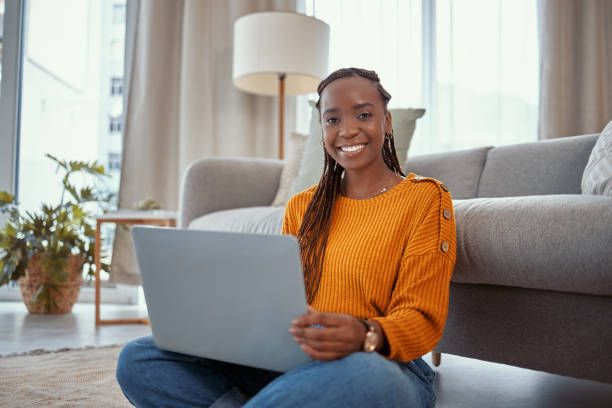 istock Shot of a young woman using a laptop while working from home 1365606823