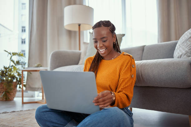 istock Shot of a young woman using a laptop while working from home 1365606837