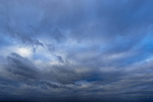 istock beautiful blue sky with clouds in the evening as abstract background 1365610307