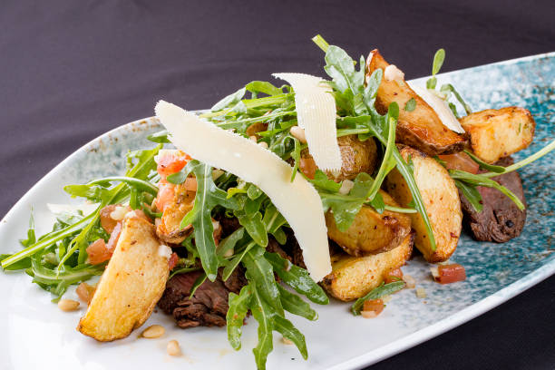 Tagliata salad, with veal, rucola, baked potatoes.