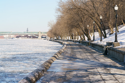 People walking at the Sparrow Hills, Vorobyovy Gory park in spring time during coronavirys pandemic lifestyle. Andreevsky (Pushkinsky) pedestrian bridge