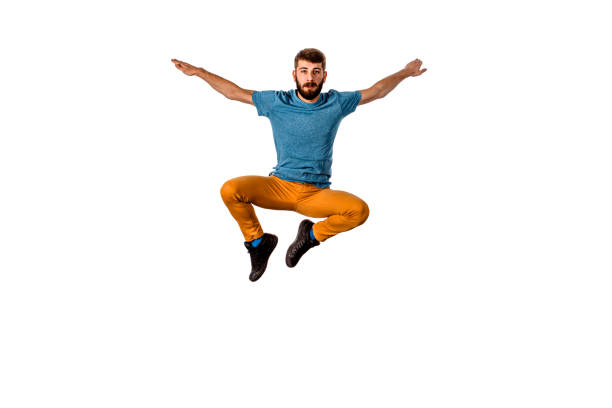 Break-dancer does expressive move and jump high isolated on white