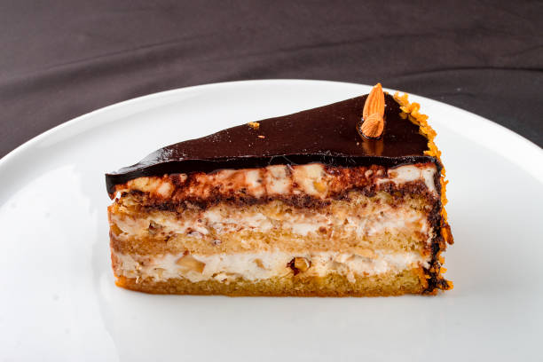 istock Cake with caramel nuts and chocolate frosting. 1365616154