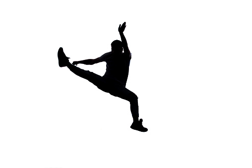 Amazing dancer is doing breakdance on a white background