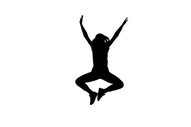 Silhouette of a young girl who's doing breakdance