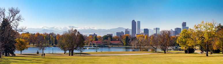 Panoramic view of downtown Denver Colorado from City Park in Fall with the front range mountains in the background