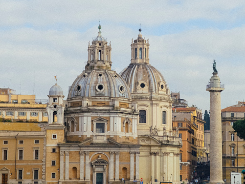 Vatican, October 07 -- A detailed view of the majestic facade of the St. Peter's Basilica with the monumental Michelangelo's dome. In the foreground, the statues of religious figures and popes that adorn Bernini's colonnade and a portion of the Apostolic Palace (right). The Basilica of St. Peter's, in the Vatican, is the center of the Catholic religion, one of the most visited places in the world and in Rome for its immense artistic and architectural treasures. In 1980 the historic center of Rome was declared a World Heritage Site by Unesco. Image in high definition format.