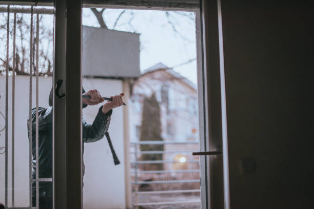 istock Burglar breaks into a residential flat 1365618717