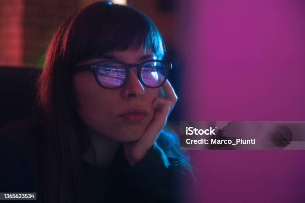 Young Woman Programmer Using Computer Stock Photo - Download Image Now - Computer Programmer, Coding, Eyeglasses