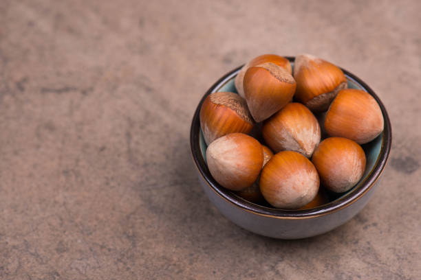 istock Hazelnuts in the nut shell, healthy food, vegan nutrions, having a snack 1365623645