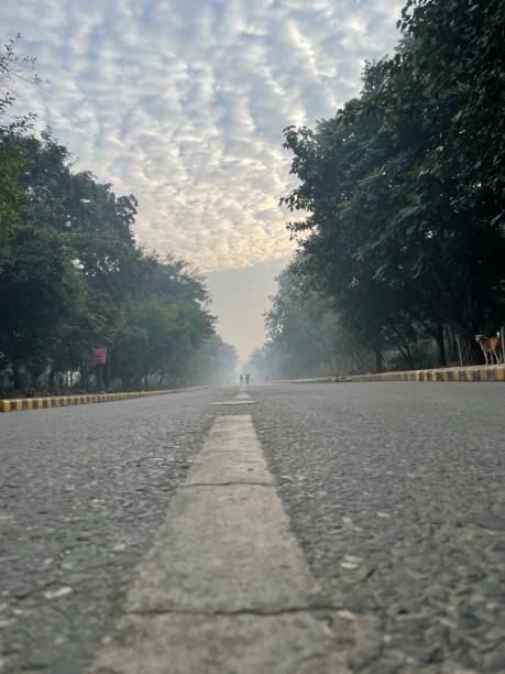 istock City Street in perspective again dramatic cloud 1365642052