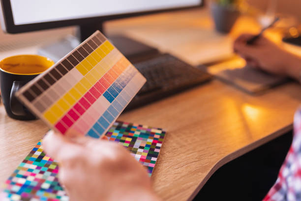 istock Designer choosing color from color pallete while working 1365642274