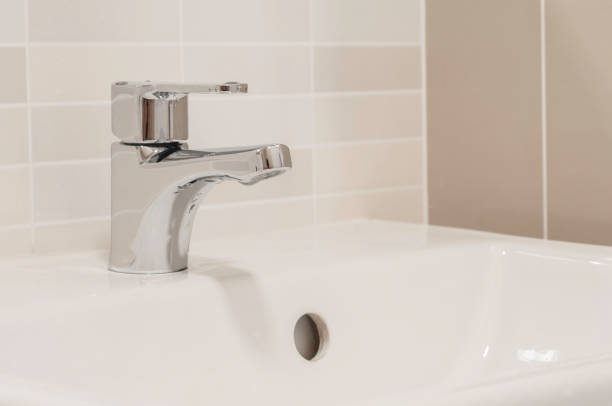 istock Stainless faucet in rest room. 1365642356
