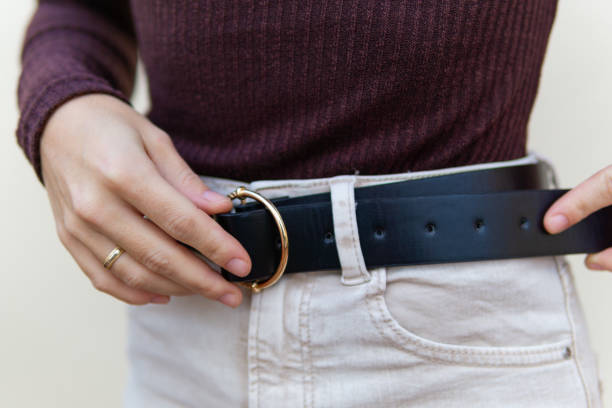 istock Unrecognizable girl with black leather belt 1365644527
