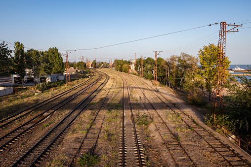 Mariupol, Ukraine - September 25, 2015: Train tracks beside the Azov Sea in Mariupol.