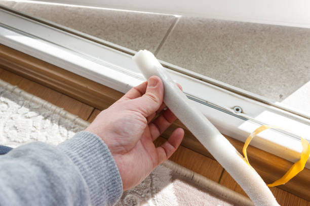 istock The man is sticking sealing tape on door 1365646301