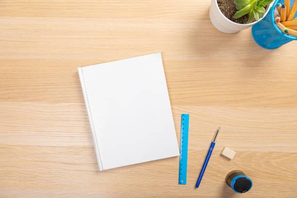 istock office stuff with pen and notepad keyboard on light wooden table top view. work at home 1365647956