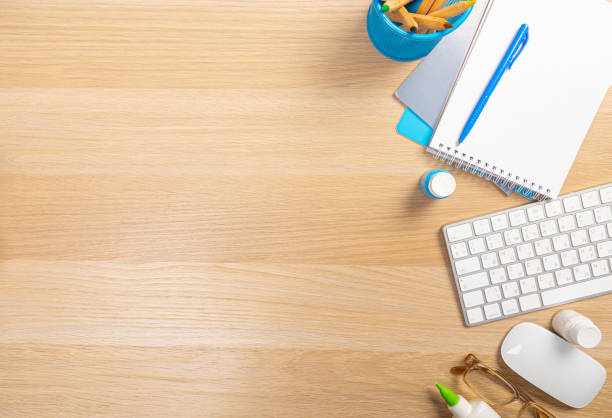 istock Office table with tablet,smartphone,pen,coffee cup, glasses and cactus, copy space,Top view, flat lay 1365647966