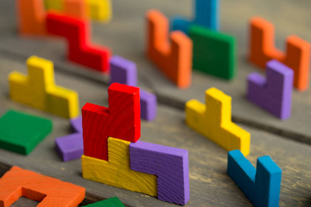 istock Creative solution for idea - business concept, jigsaw puzzle on the wooden desk 1365649446